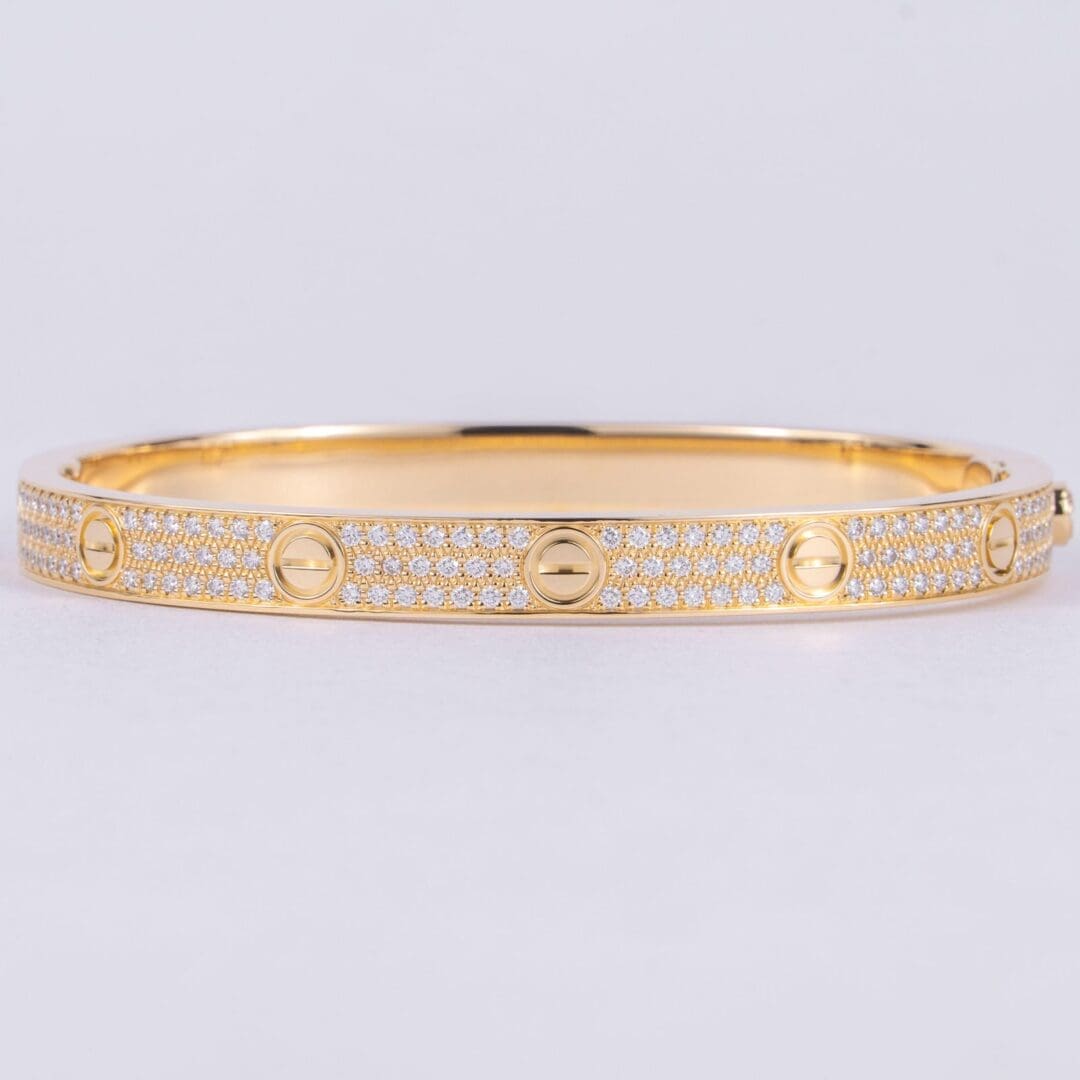 Gold bracelet with diamond accents.