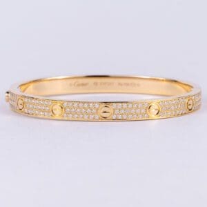 Gold bracelet with diamond accents.