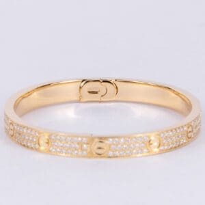 Gold bracelet with diamond accents.