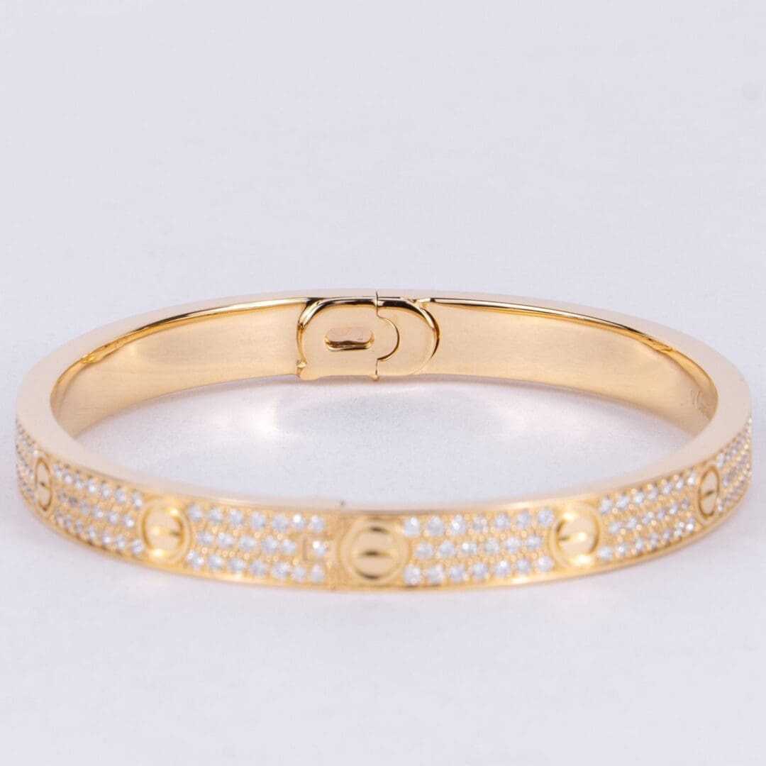 Gold bracelet with diamond accents.