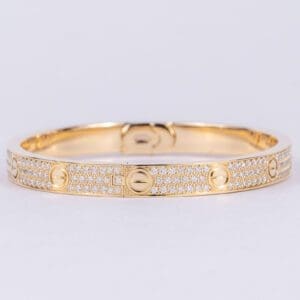 Gold bracelet with diamond embellishments.