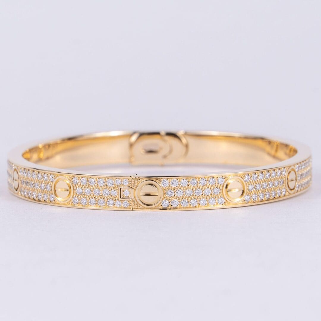 Gold bracelet with diamond embellishments.