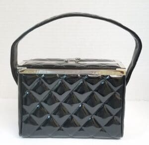Black quilted handbag with a single handle.