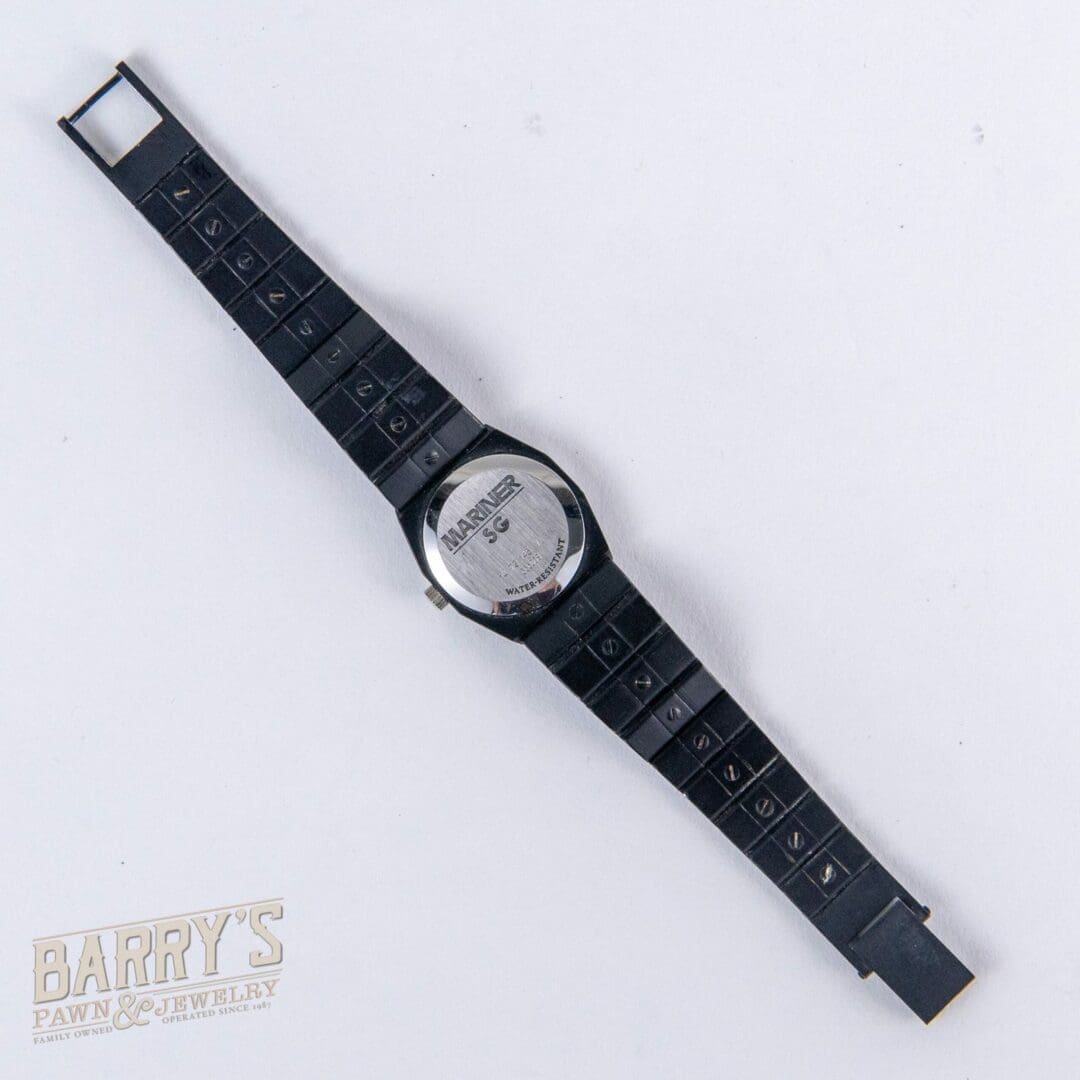Black wristwatch with Marvel logo on back.