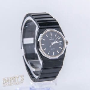 Black wristwatch with date display, octagonal case.