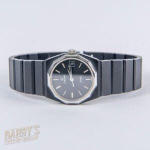 Black wristwatch with octagonal face design.