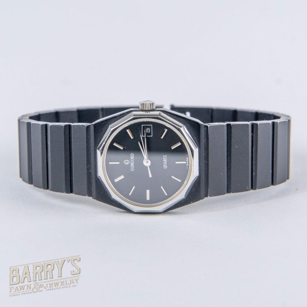 Black wristwatch with octagonal face design.