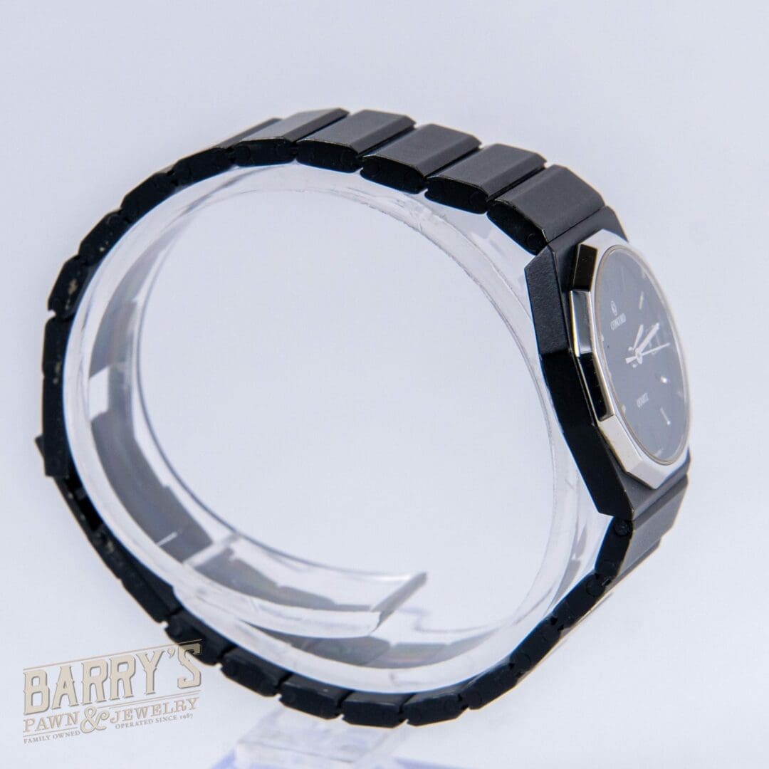 Black watch with a sleek metal frame.