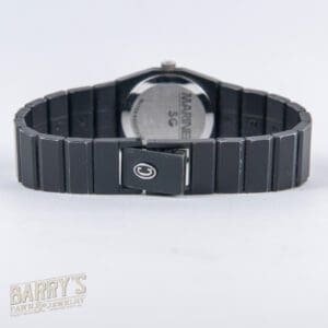 Black wristwatch with metal band, back view.