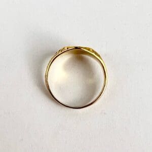 Gold ring on a white background.