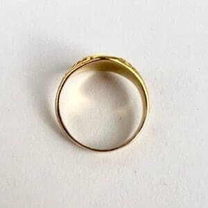Gold ring on white background.