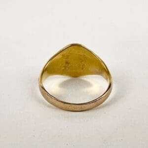 Gold ring with engraved inner surface.