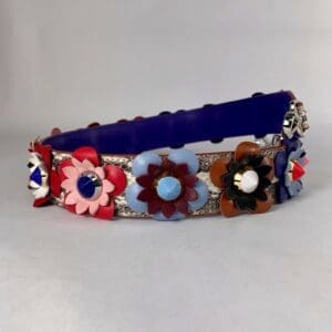 Floral embellished belt with colorful flowers.