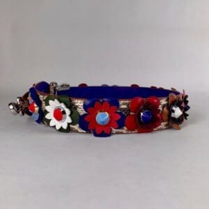 Colorful floral dog collar with bell accents.