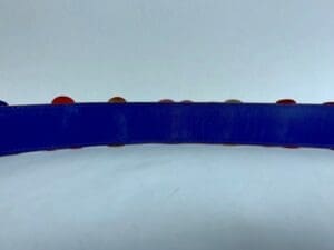 Blue strap with multicolored round buttons.