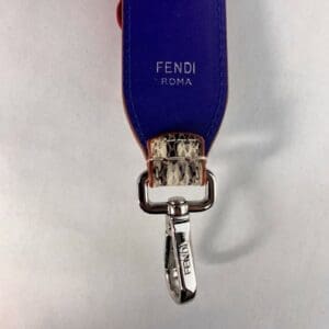 Blue Fendi Roma keychain with metal clip.