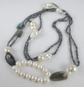 Beaded necklace with pearls and gemstones.