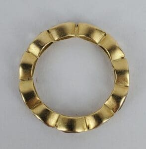 Gold ring with a segmented design.