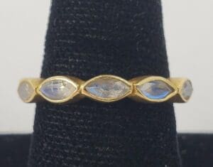 Gold ring with marquise-cut gemstones.
