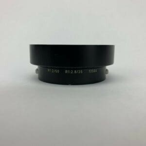 Camera lens adapter on white background.