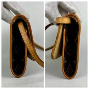 Brown leather wallet with patterned interior.