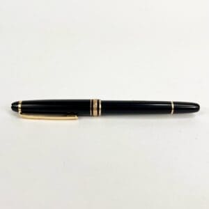 Black and gold fountain pen on white.