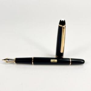 Black fountain pen with gold accents.