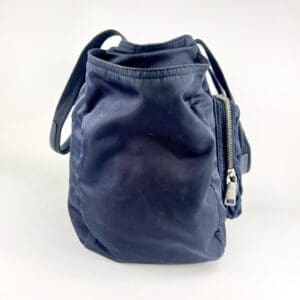 Dark blue backpack with zipper pocket.