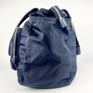 Dark blue backpack with zippers.
