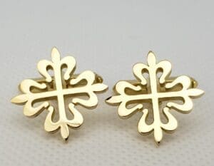 Gold decorative cross-shaped earrings.