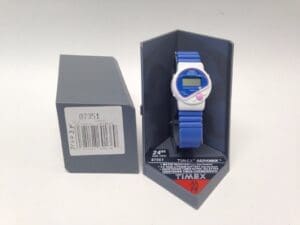 Blue digital Timex watch in packaging.