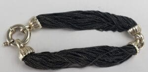 Black braided bracelet with silver clasp.