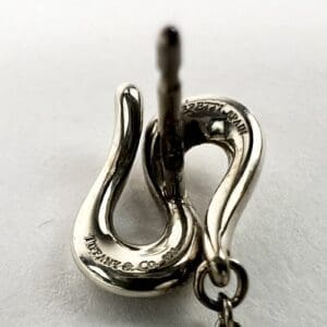 Silver snake-shaped Tiffany & Co. earring.