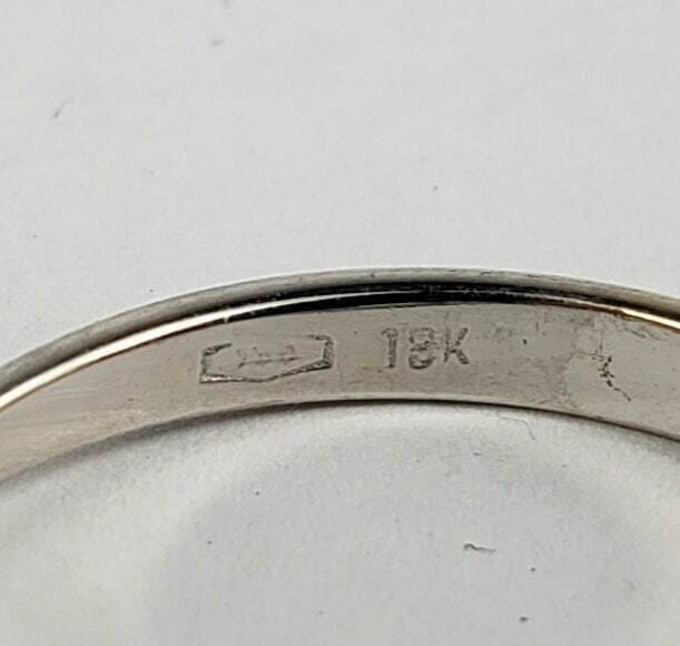 18K gold ring with hallmark stamp.