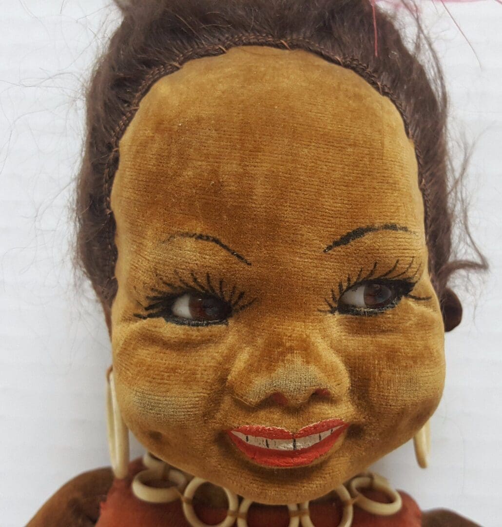 Vintage doll with earrings and necklace.