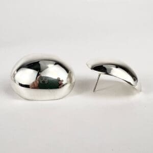 Silver, pebble-shaped clip-on earrings.