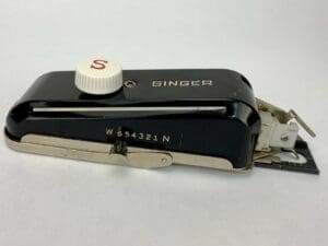Vintage Singer sewing machine attachment.