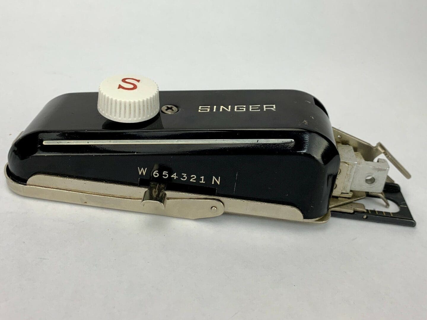 Vintage Singer sewing machine attachment.