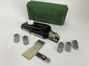 Vintage Singer sewing machine accessories set.