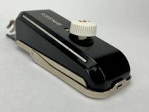 Black vintage Singer sewing machine attachment.