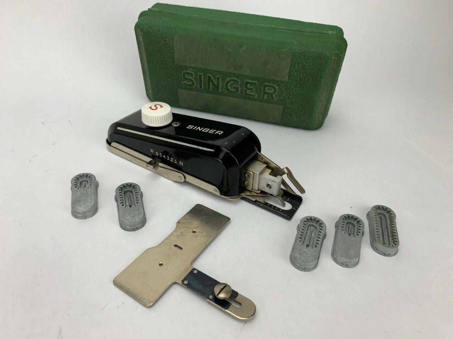 Vintage Singer sewing machine accessories set.