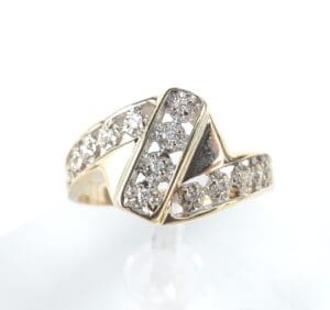 Gold ring with diamond accents on display.