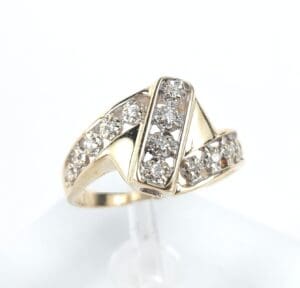 Gold ring with multiple diamond accents.
