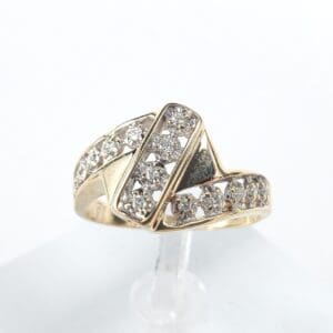Gold ring with diamond accents on display.