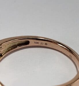 Gold ring with 10K hallmark stamp.