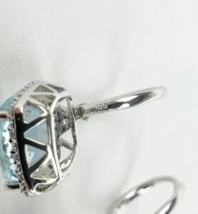 Silver ring with blue gemstone close-up.