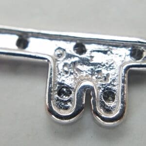 Close-up of a metallic object with screws.