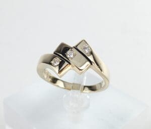 Gold ring with three small diamonds.