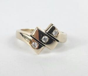 Gold ring with three small diamonds.