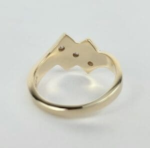 Gold ring with geometric cat design.